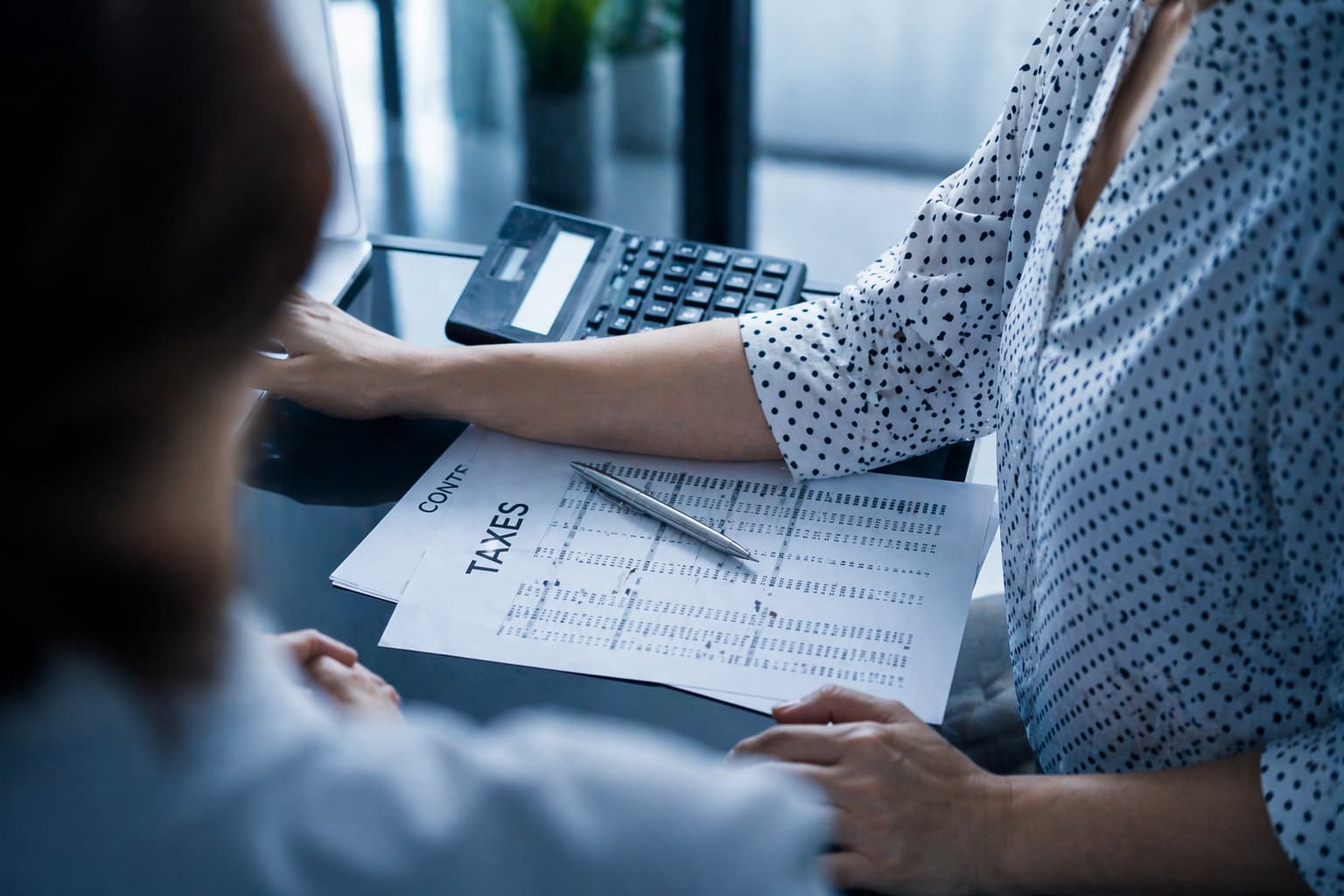 Businesswoman reviewing IRS Fresh Start Program options with a tax professional in Corpus Christi
