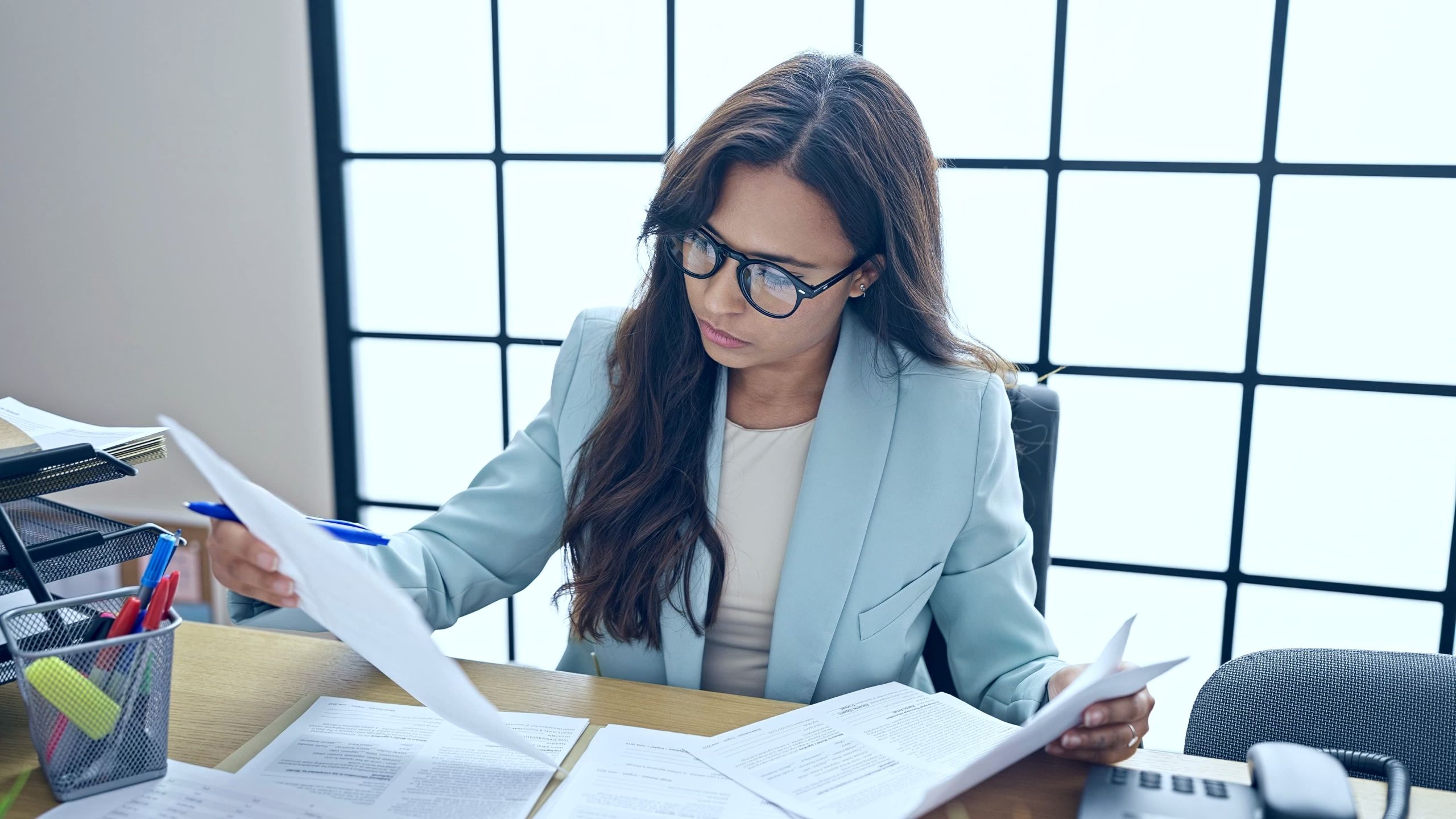 Woman reviewing IRS Fresh Start Program options with a tax professional in El Paso