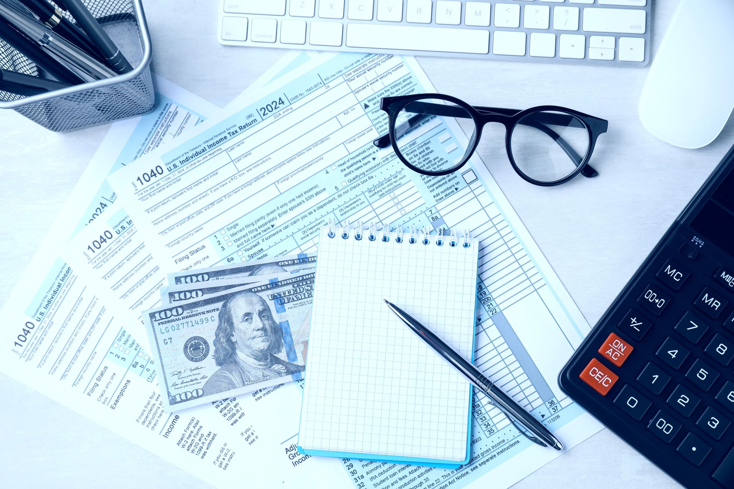 Tax debt negotiation documents on desk representing IRS debt relief services in El Paso