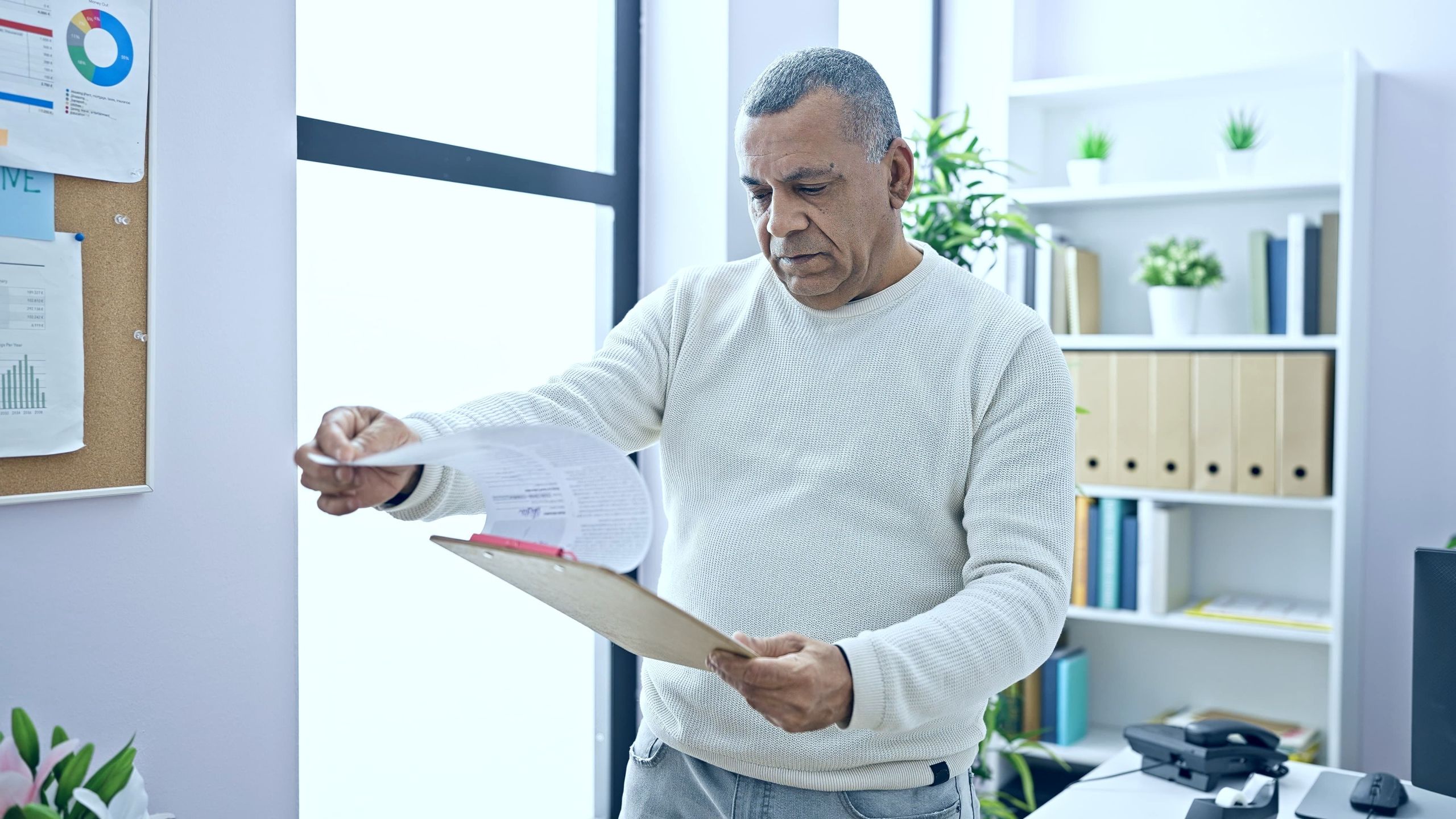 Man reviewing IRS Fresh Start Program options with a tax professional in Houston