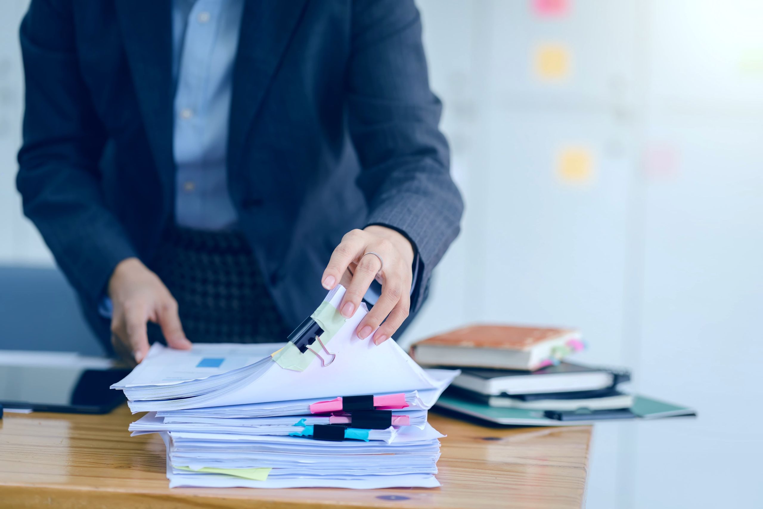 Tax documents and organized folders on desk representing IRS debt relief services in Jacksonville