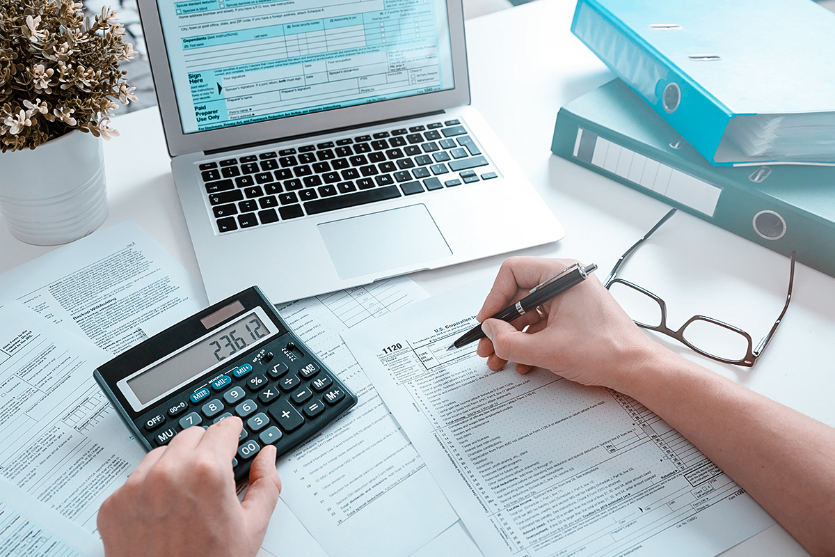 Tax binder and highlighted documents on desk representing IRS debt relief services in Yonkers