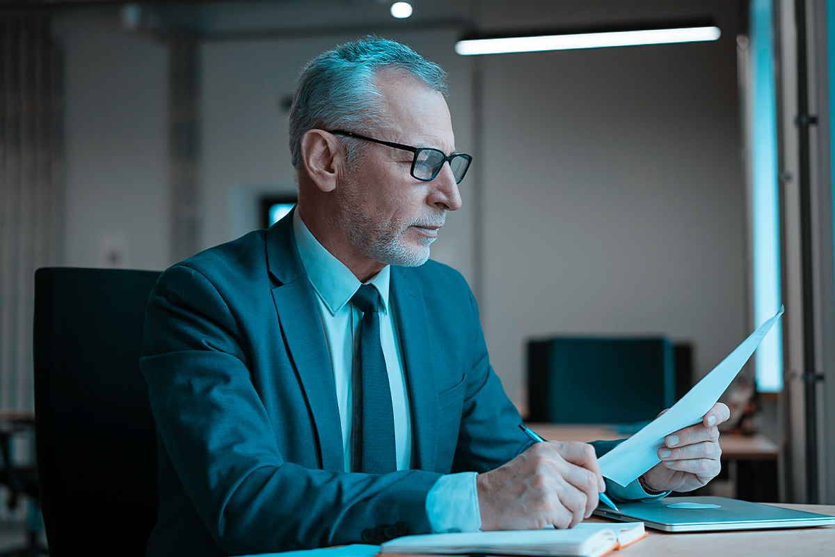 Businessman reviewing IRS Fresh Start Program options with a tax professional in Fresno