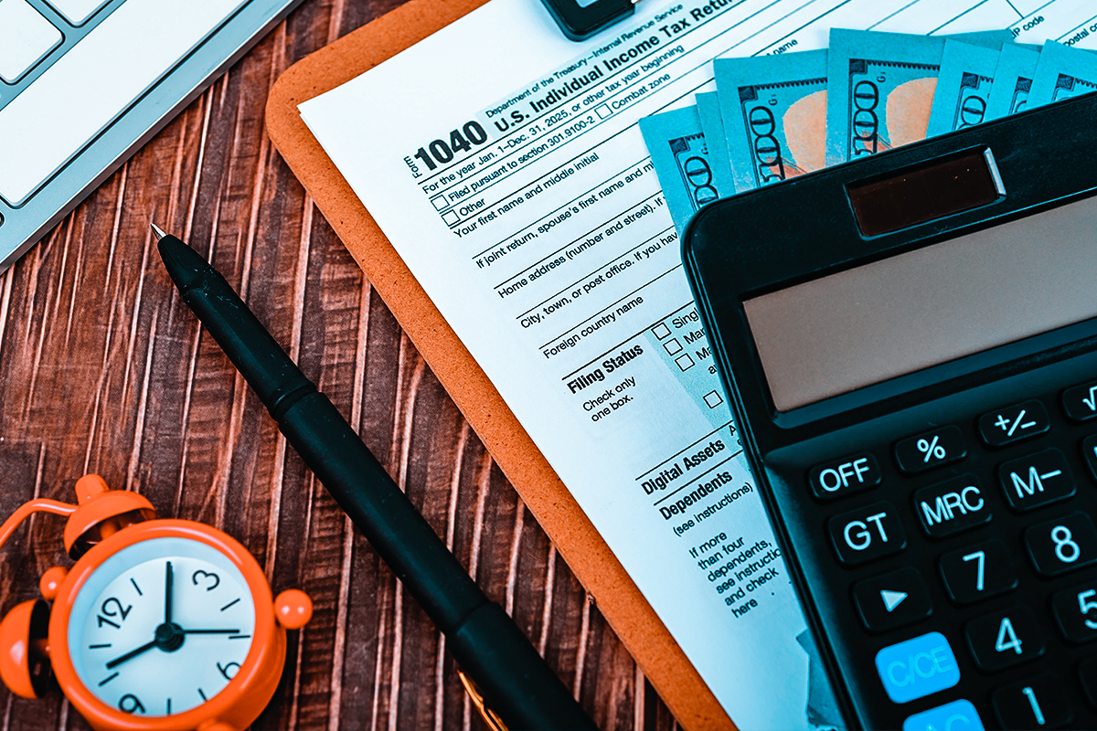 Tax forms and calculator on desk representing IRS debt relief services in Buffalo