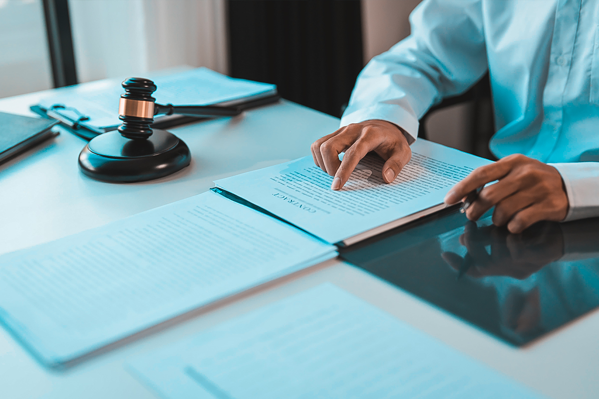 Tax law books and gavel on desk representing IRS debt relief legal services