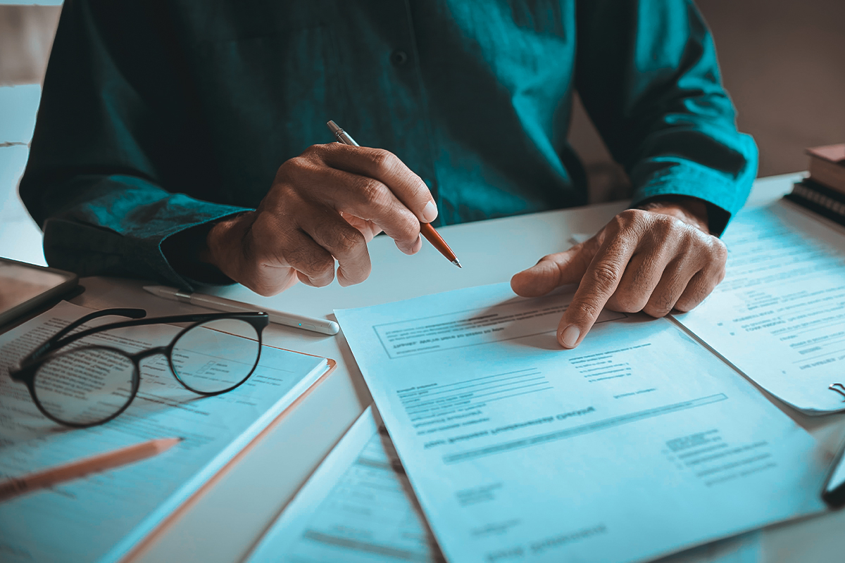 Man reviewing IRS Fresh Start Program details with a tax professional in Oakland