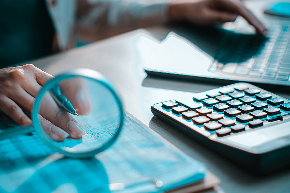 Financial documents and spreadsheet on desk for IRS debt relief services