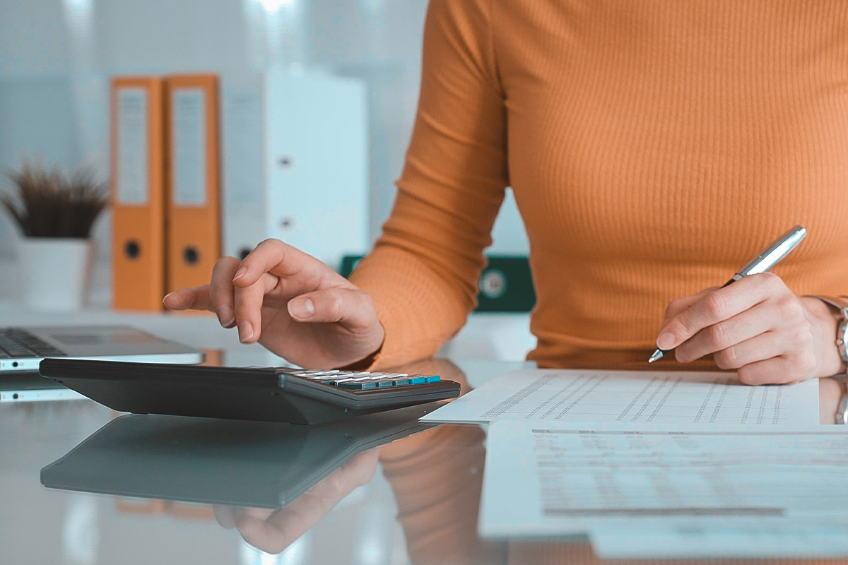 Tax documents and organized paperwork on desk for IRS debt relief services