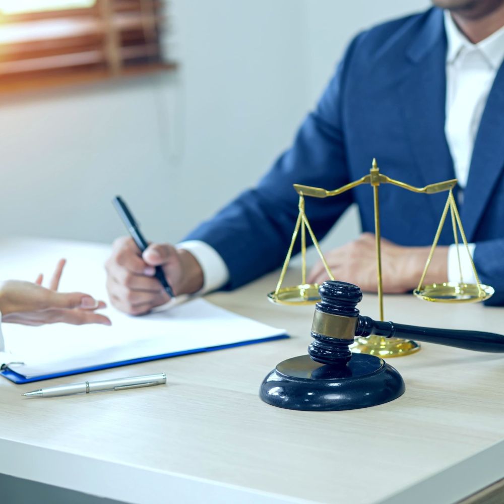 Tax attorney consulting with client in El Paso to discuss IRS debt relief options