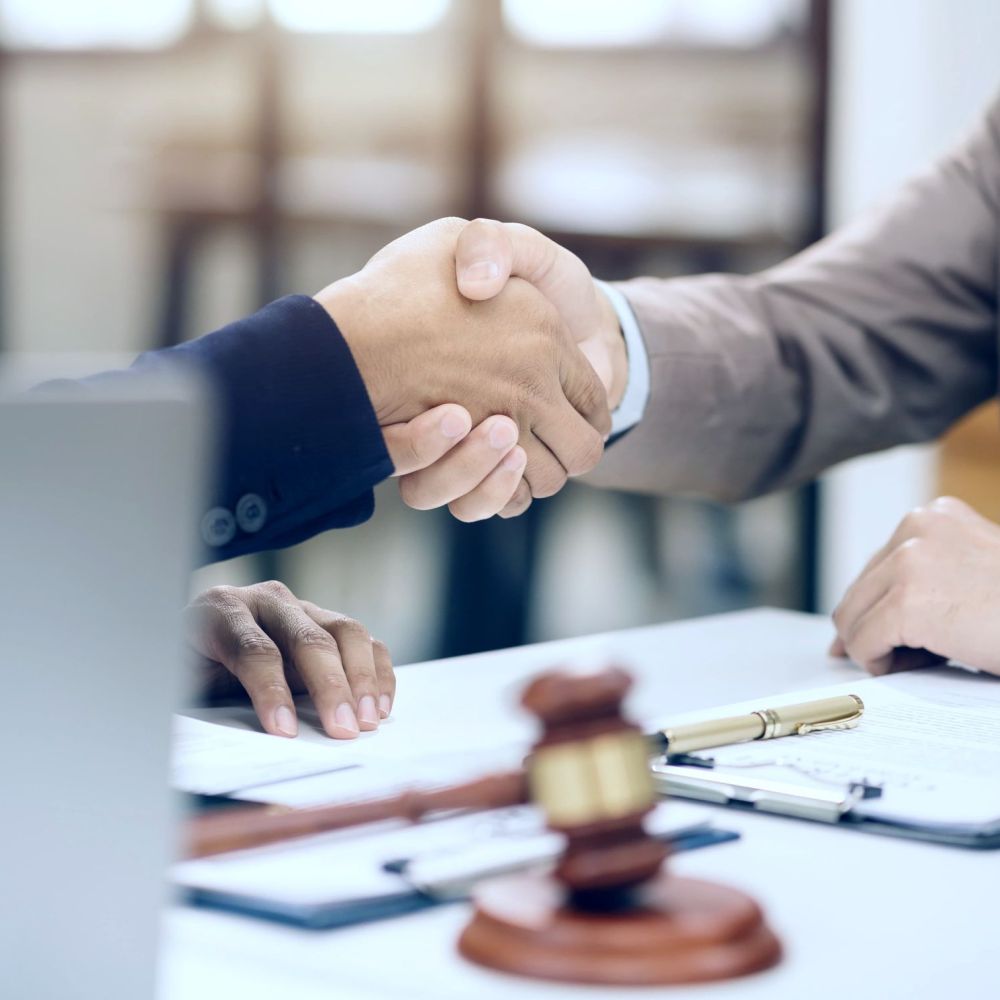 Tax attorney and client reaching IRS debt relief agreement in San Antonio