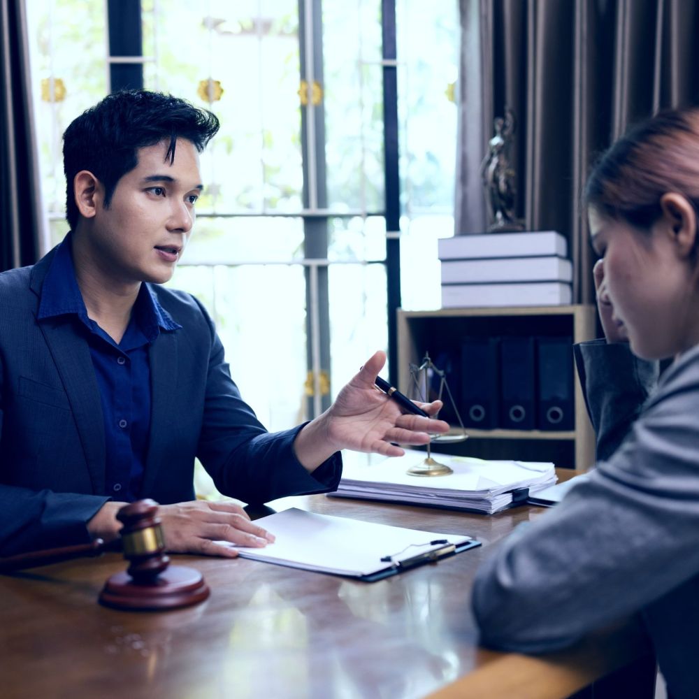 Tax attorney reviewing IRS debt relief case with client in Houston