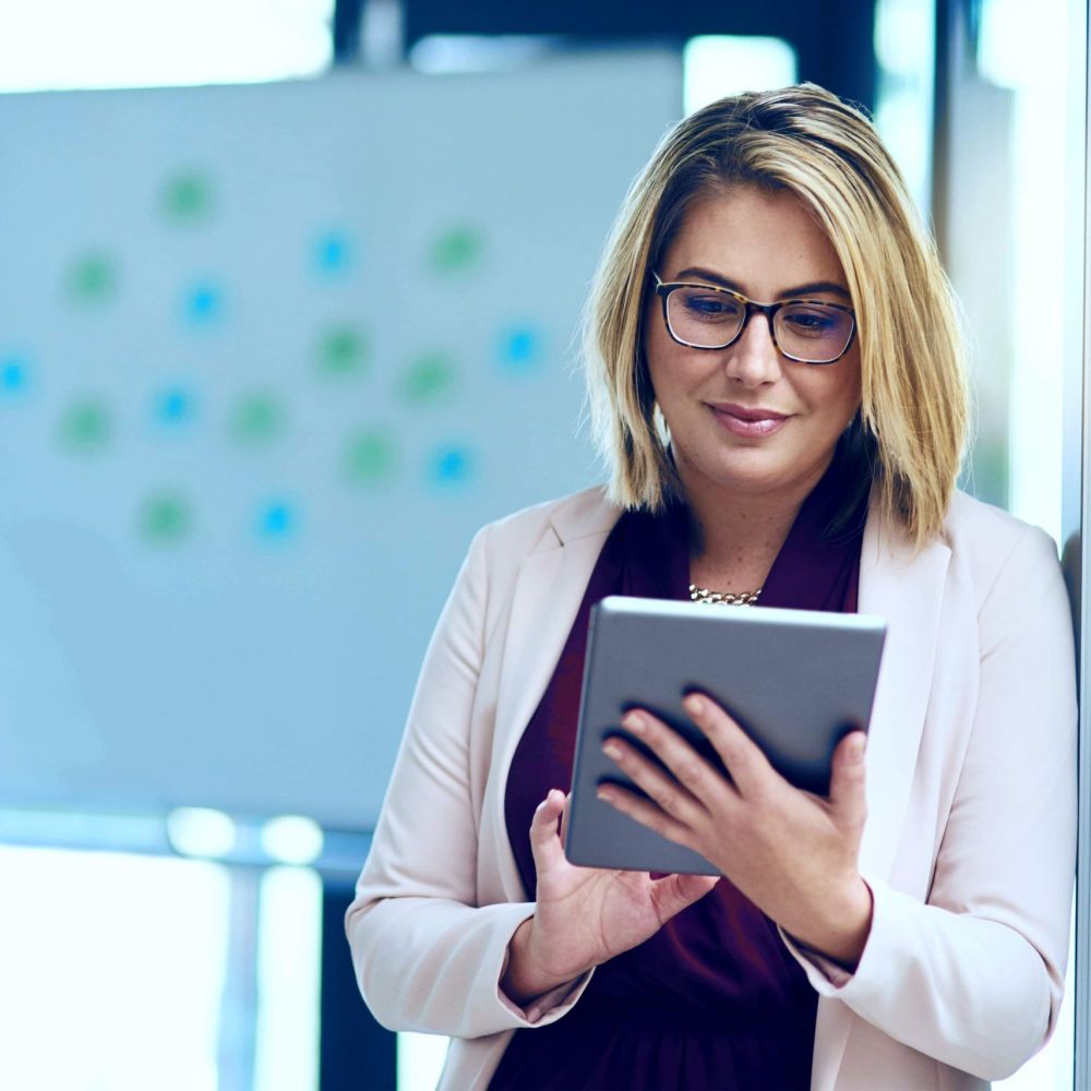 Tax attorney reviewing IRS Offer in Compromise eligibility and case details on tablet