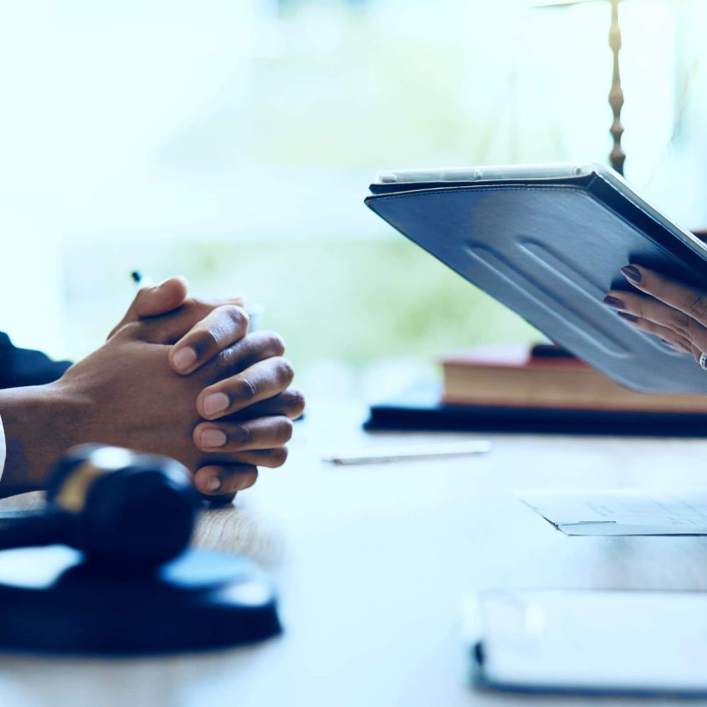 Tax resolution attorney meeting with client to review IRS case documents and legal options