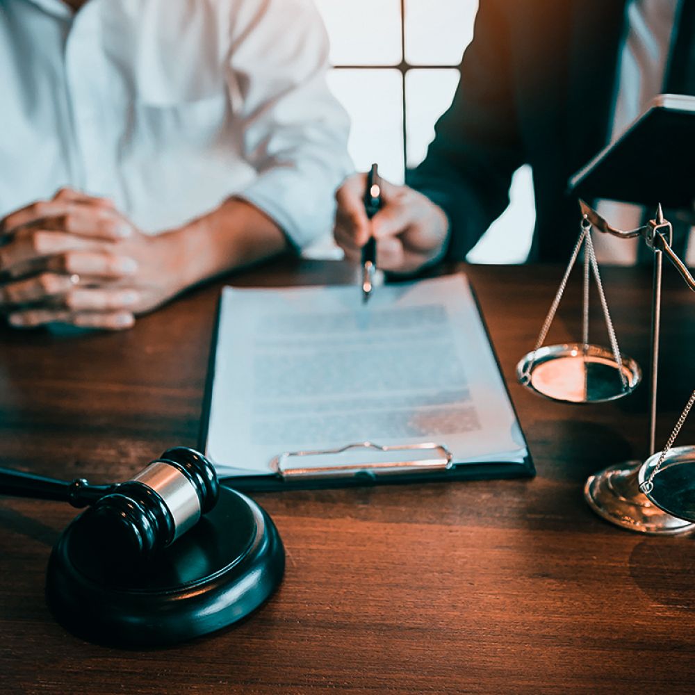 Tax attorney reviewing IRS debt relief documents with client in Buffalo