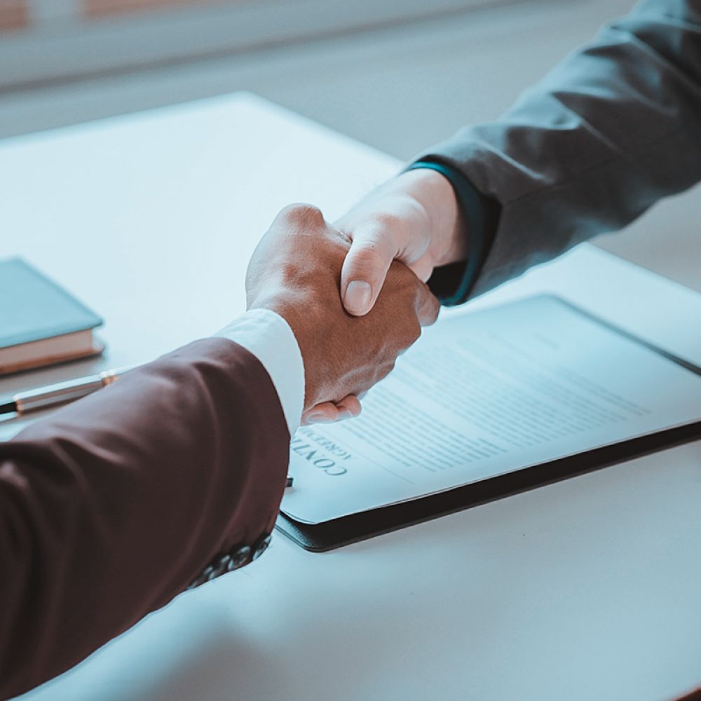 Tax attorney and client in Anaheim reaching agreement on IRS debt relief solution